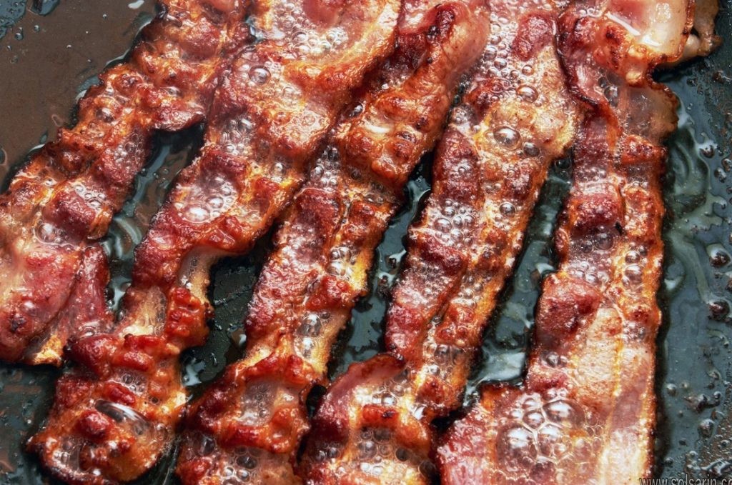 how much bacon do americans eat a year?